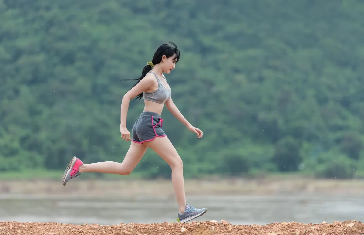 woman jogging outdoors to boost energy without caffeine
